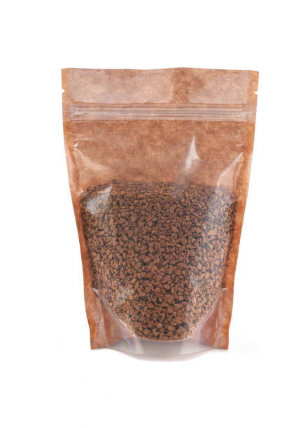 istock Instant coffee in a brown paper bag. Doy-pack with a plastic window for bulk products. Close-up. White background. Isolated. 1310393286