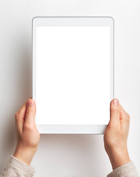 Women using digital tablet on white background stock photo