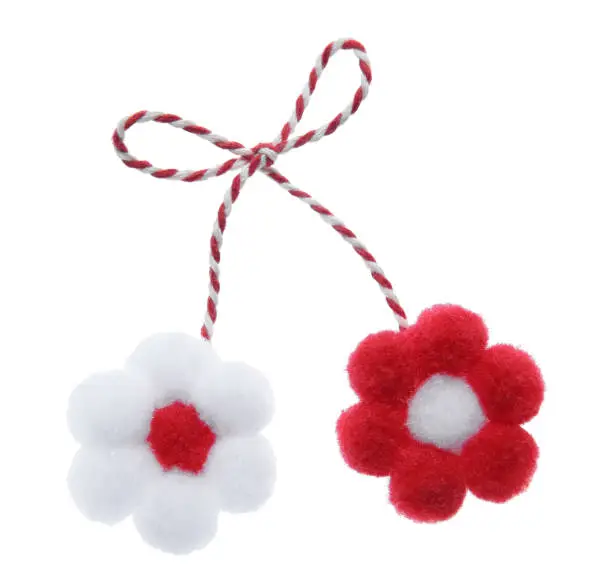 Traditional martisor with flowers on white background. Beginning of spring celebration