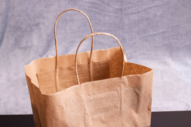 istock Paper shopping bag on a gray background 1310395763