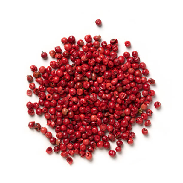 pink peppercorn – pile of dried pepper berry, flavoring spice - pink peppercorn imagens e fotografias de stock