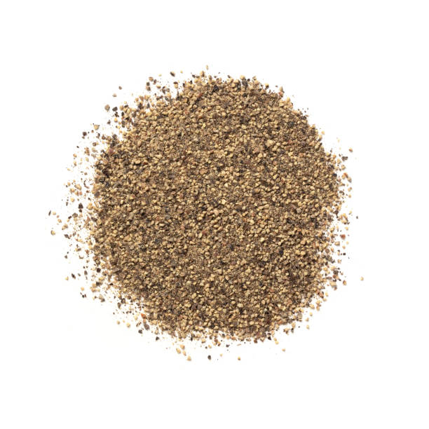 Crushed Black Pepper – Heap of Peppercorn Powder, Flavoring Dried Spice Crushed Black Pepper – Heap of Peppercorn Powder, Flavoring Dried Spice – Top View, Close-Up Macro, from Above – Isolated on White Background black peppercorn photos stock pictures, royalty-free photos & images