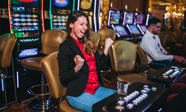 Woman Winning On Slot Machine In Casino Stock Photo - Download Image Now -  Slot Machine, Casino, Party - Social Event - iStock