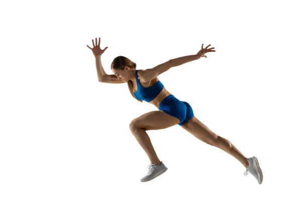istock Young female track athlete training isolated over white studio background. 1310399469