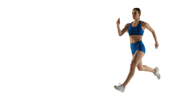 istock Young female track athlete training isolated over white studio background. 1310399471
