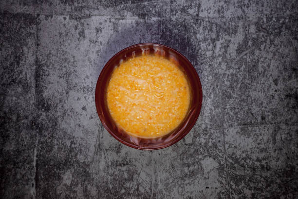 istock Wheat porridge with almond milk on dark textured background 1310400672