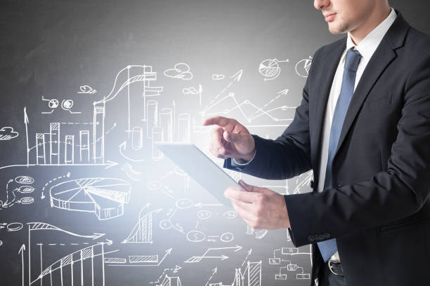 istock Man with tablet and business strategy 1310400846