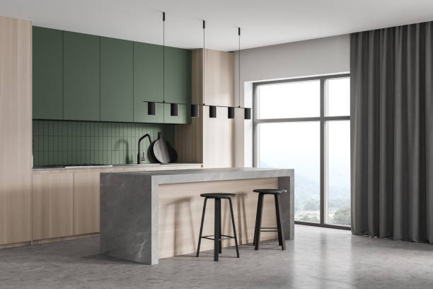 istock Wooden kitchen set with cutting table and two chairs near window 1310402012