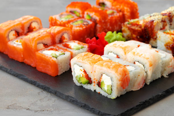 istock Set of various sushi rolls served on gray background 1310402907