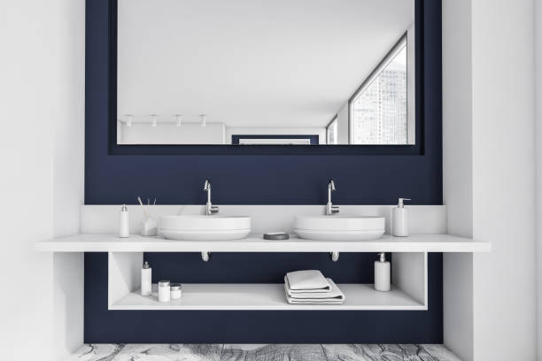 istock Concrete white and blue bathroom interior with a grey marble floor, a double sink and a loft window city view. 3d rendering 1310403155