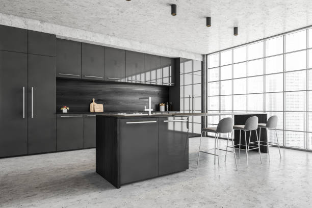 istock Black and grey dining room, kitchen near window with chairs and table 1310403284