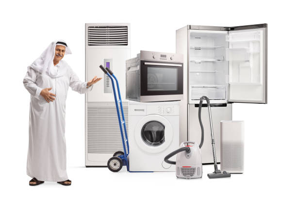 Mature arab man showing home appliances isolated on white background