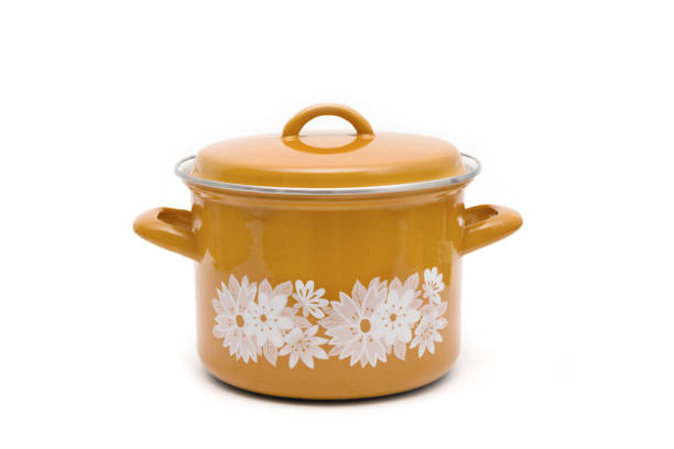 One orange vintage enamel Pot isolated