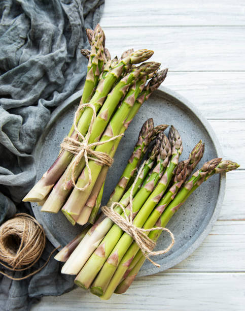 istock Bunch of raw asparagus stems 1310405435