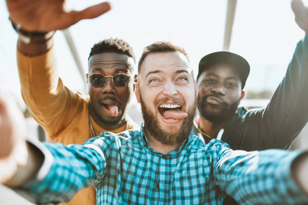istock Crazy Multiethnic Friends Making Funny Face During Selfie Outside 1310405597