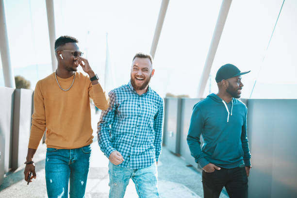 istock Multiethnic Friends Enjoying A Walk Outside On Footbridge 1310405627