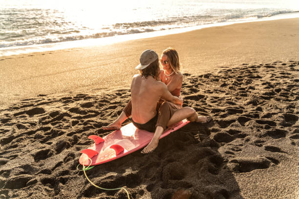 istock Happy people having fun together, hugging, spending free time on the sandy beach. 1310405788