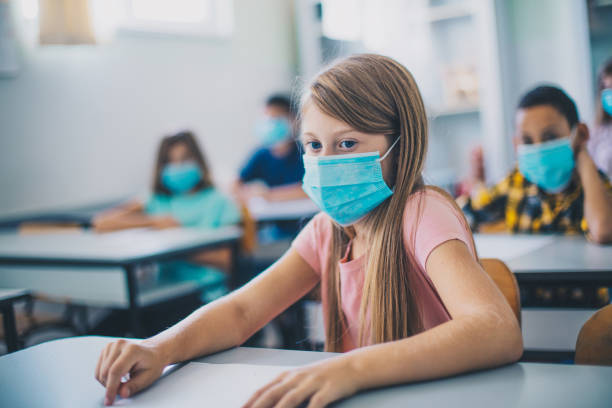 istock Writing A Test. Teenagers students sitting in the classroom. 1310407792