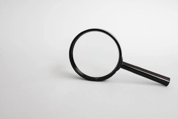 istock Magnifying glass on a gray background 1310408783