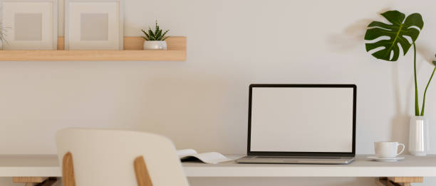 istock 3D rendering, simple home office interior design with laptop, books and decorations 1310409332