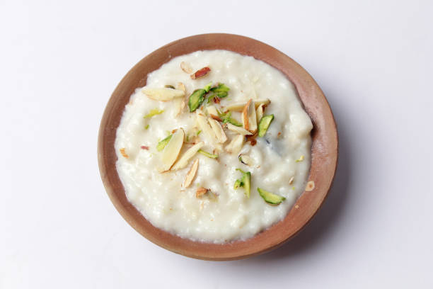 istock Isolated Kheer with almond topping, Beautiful dessert bowl on white background, Eid dinner meal. 1310409607