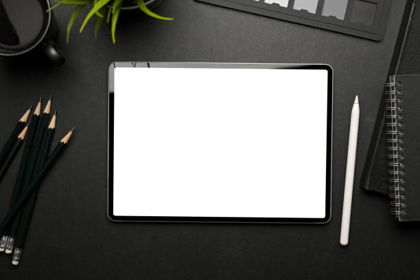 istock Top view of creative flat lay workspace with digital tablet include clipping path and supplies 1310409617