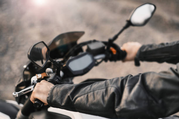 istock Motorcyclist holding handles while sitting on a motorcycle 1310410864