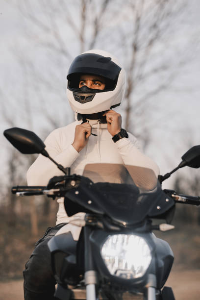 istock The motorcyclist sitting on his motorcycle. 1310411836