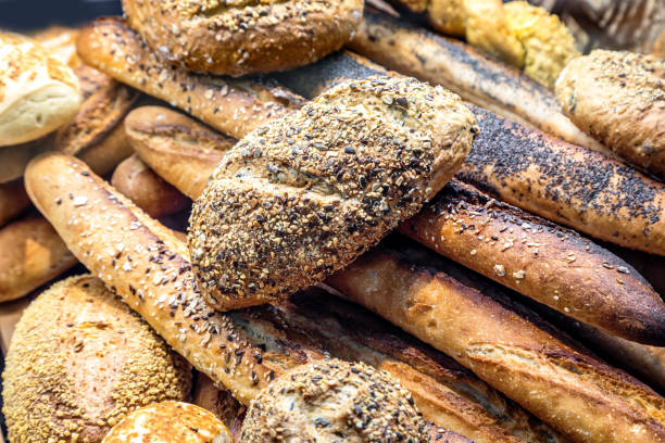 istock many different types of bread. Wholegrain, round, rolls and loaves 1310413906