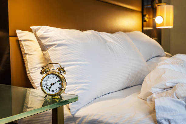 istock mechanical alarm clock is placed on the bedside table at home 1310414010