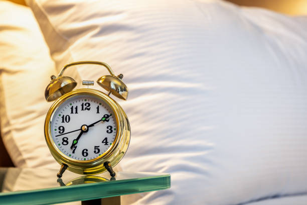 istock mechanical alarm clock is placed on the bedside table at home 1310414015