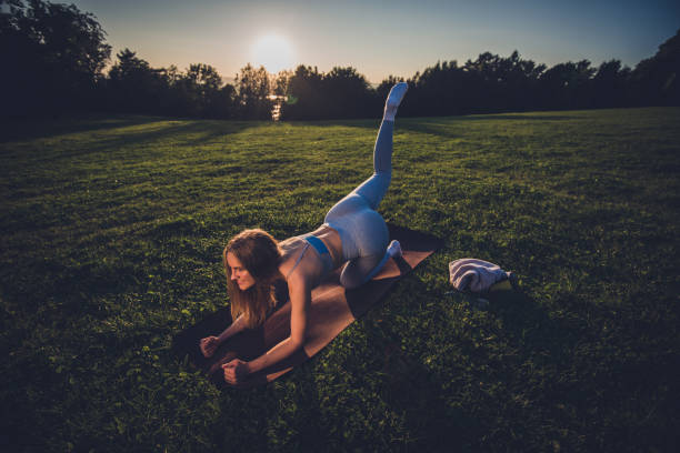 istock Athletic woman exercising at the park 1310414979