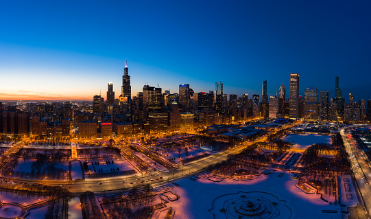 Urban Skyline of Chicago Loop at Night in Winter. Blue Hour. Aerial View. United States of America.