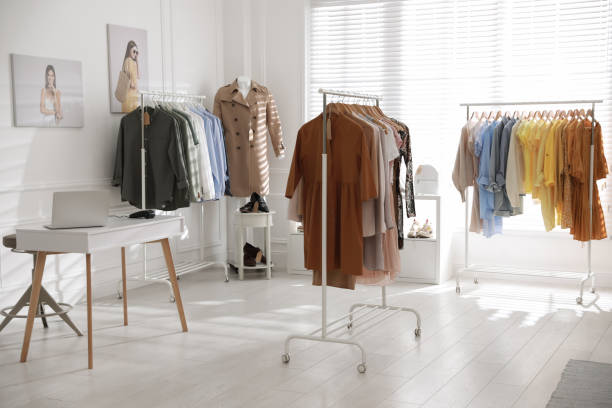 istock Modern boutique interior with stylish clothes and laptop 1310416325
