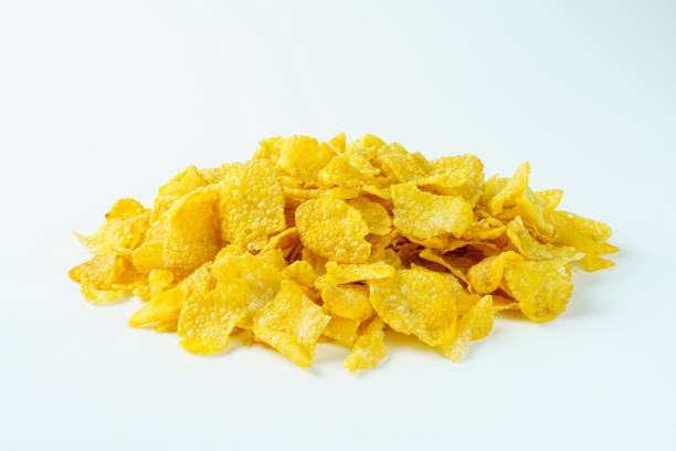 istock Pile of yellow cornflakes with white background 1310416639