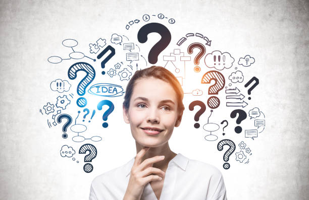 istock Cheerful young woman, question marks 1310418644