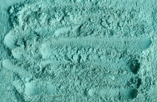 istock Blue, green bentonite clay powder (alginate, facial mask, eye shadow, body wrap) texture close up, selective focus. Abstract background. 1310422718