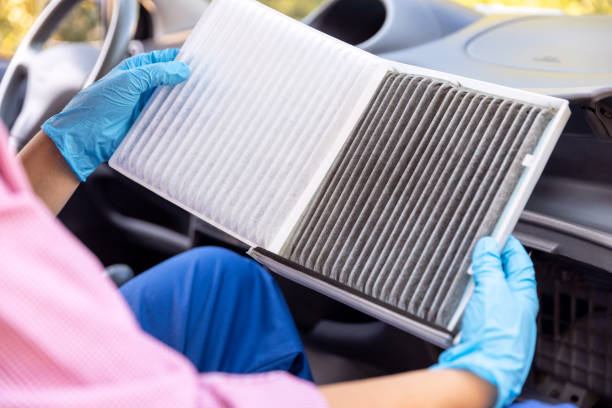 istock Replacement of cabin pollen air filter for a car. Basic auto mechanic skills concept. 1310424023