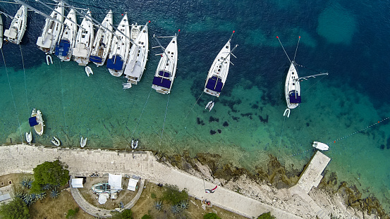 Aerial view on marina bay with sailboats and yachts.