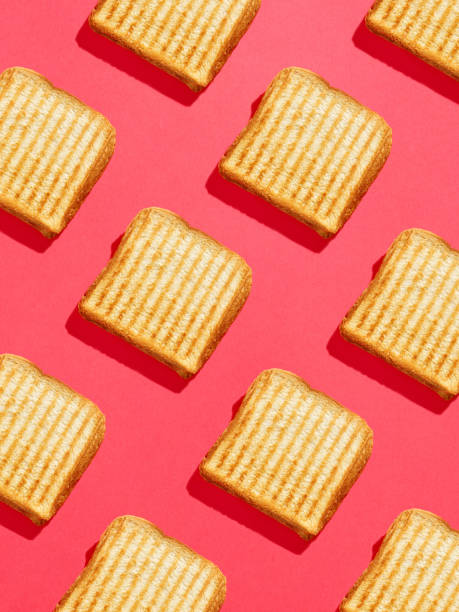 istock Toasted sandwich pattern on pink background, from above, hard shadow 1310424271