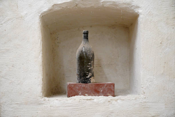 This is a moldy stone wall through damp walls structure photographed in daylight