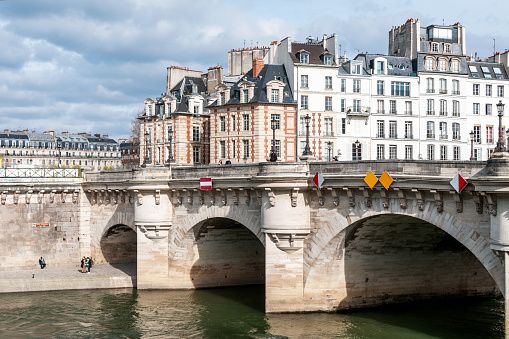 Pont Neuf, the oldest bridge across the Seine river in Paris, France. March 19, 2021