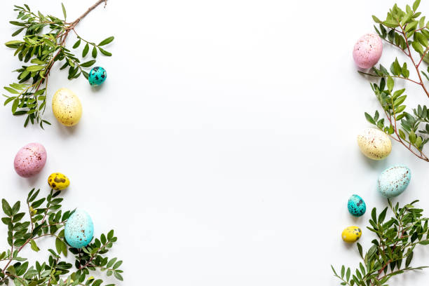 istock Happy Easter with colorful eggs and green branch, top view 1310426213