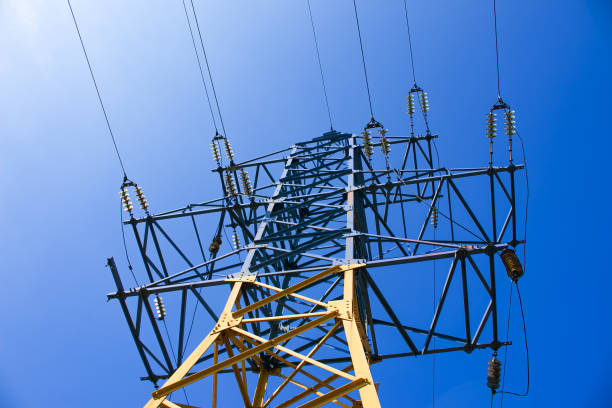 istock Power lines. High voltage power line against the blue sky. 1310426402