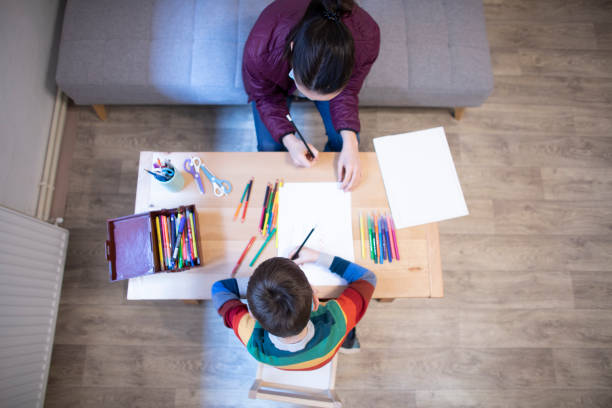 istock Psychotherapist is having a play session with a boy during coronavirus 1310427505