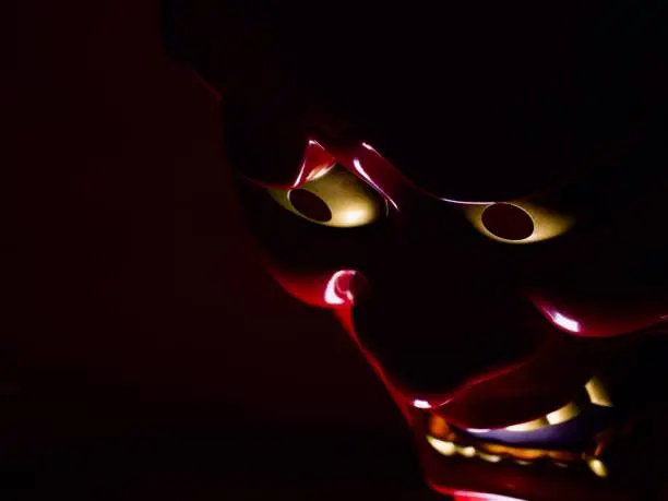 Red oni (demon) mask, which is usually worn during Setsubun (bean throwing festival), in darkness