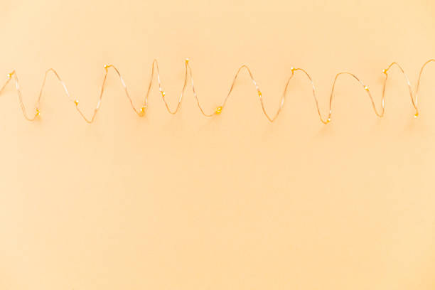 istock Orange background with illuminated LED garland lights 1310428740