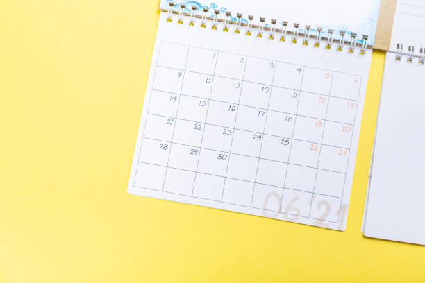 istock White blank 2021 calendar on solid yellow background with copy space, business meeting schedule, travel planning or project stage and reminder concept. 1310428804