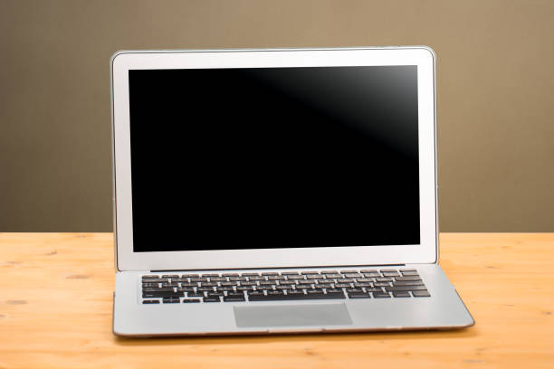 istock Laptop on Computer Desk and Laptop with blank screen for product display in office with modern blurred background. work from home 1310428848