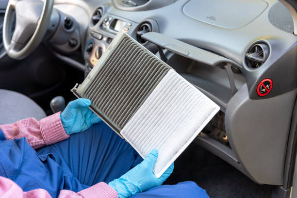 istock Replacement of cabin pollen air filter for a car. Basic auto mechanic skills concept. 1310429065